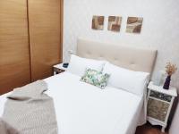 A bed or beds in a room at La Dorada