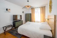 Łóżko lub łóżka w pokoju w obiekcie Suites Mana - Le Manaloft, Chic et moderne avec salle privée de Fitness en plein centre-ville de Rethel