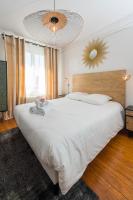 Łóżko lub łóżka w pokoju w obiekcie Suites Mana - Le Manaloft, Chic et moderne avec salle privée de Fitness en plein centre-ville de Rethel