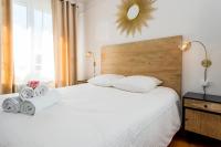 Łóżko lub łóżka w pokoju w obiekcie Suites Mana - Le Manaloft, Chic et moderne avec salle privée de Fitness en plein centre-ville de Rethel