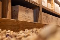 a wooden box on a shelf with a pile of mushrooms at Le 11 des Bouchaux, Gîte d&#39;exception in La Bresse