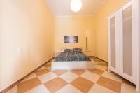 Łóżko lub łóżka w pokoju w obiekcie Grand Latina Apartment