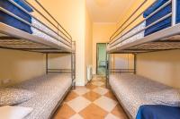 Łóżko lub łóżka w pokoju w obiekcie Grand Latina Apartment