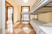 Łóżko lub łóżka w pokoju w obiekcie Grand Latina Apartment