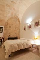 A bed or beds in a room at Tito Schipa B&B