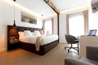 Postel nebo postele na pokoji v ubytování Woohoo Rooms Boutique Sol