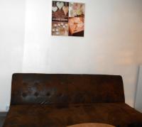 a couch in a room with a picture on the wall at Entre Saint-Tropez et les gorges du Verdon. in Lorgues