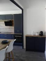 Kuchyň nebo kuchyňský kout v ubytování Spacieux appartement au pied de la cité médiévale