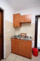Kuchyň nebo kuchyňský kout v ubytování Apartments by the sea Murter - 5078