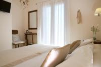 Posteľ alebo postele v izbe v ubytovaní Kores Villas