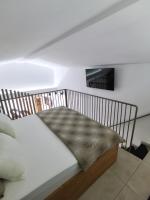 A bed or beds in a room at Alfa Studio