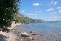 a view of a beach with rocks in the water at Apartment Seline 11197b in Starigrad