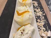 three desserts on a white plate on a table at LE PATIO in Millau