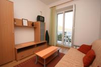 Televízia a/alebo spoločenská miestnosť v ubytovaní Apartment Podgora 6764b