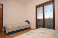 Apartment Starigrad 6606b tesisinde bir odada yatak veya yataklar