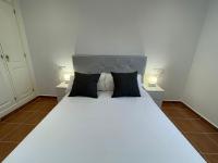 Postel nebo postele na pokoji v ubytování El Mirador del Coto, Apartamentos Living Sur