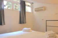 Posteľ alebo postele v izbe v ubytovaní Cozy & large Loft FAMAGOSTA