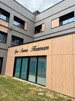 a building with a sign that reads gut cancer hammann at Best Western Plus Le Conquerant Rouen Nord in Bois-Guillaume