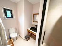 a bathroom with a toilet and a sink and a mirror at Bienvenue au Mas du Roulier, villa provençale avec vue hypnotique sur la chaine des Puys in Thiers
