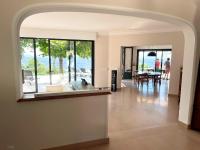 an open living room with a view of the ocean at Bienvenue au Mas du Roulier, villa provençale avec vue hypnotique sur la chaine des Puys in Thiers