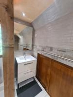 a bathroom with a sink and a bath tub at LE GALOPIN Etaples le Touquet in Étaples