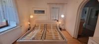 Posteľ alebo postele v izbe v ubytovaní Innenstadtgarten-Wohnung