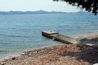 a dock on the shore of a body of water at Apartments with WiFi Zadar - 14529 in Zadar