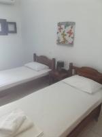 Postel nebo postele na pokoji v ubytování Mani Blue Studios
