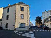 a building on the side of a street at Les Suites de Bougainville in Concarneau