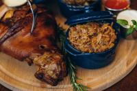 a plate of food with meat and rice on a table at BLUE mountain in Bukovel