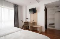 Postel nebo postele na pokoji v ubytování Hotel Alda Centro Gijón