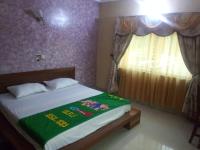 Bois vert Hôtelにあるベッド