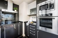 Kuchyň nebo kuchyňský kout v ubytování Lodging Apartments Forum Llull