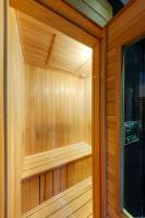 a sauna with wooden walls and a window at Hotel Double One in Taipei
