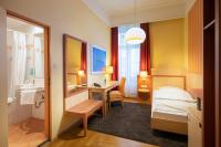 a hotel room with a bed and a bathroom at ACHAT Sternhotel Bonn in Bonn