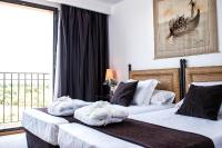 Postel nebo postele na pokoji v ubytování Termes Montbrio Hotel & Spa