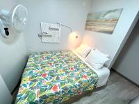A bed or beds in a room at Camp Nou, Europa Fira - modern two-bedroom apartment with heating