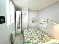 A bed or beds in a room at Camp Nou, Europa Fira - modern two-bedroom apartment with heating