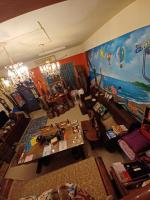 an overhead view of a living room with a painting at Hualien Seaside B&amp;B in Hualien City