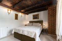 Postel nebo postele na pokoji v ubytování Casa-Pietra Porec