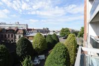 a view from a balcony of trees and buildings at Beautiful apartment with a balcony in the heart of Lille - Welkeys in Lille