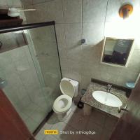 a bathroom with a shower and a toilet and a sink at Hospedagem Recanto dos Ties in Abraão