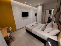 Posteľ alebo postele v izbe v ubytovaní Pleasant Stay