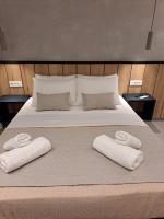 Posteľ alebo postele v izbe v ubytovaní Pleasant Stay