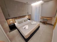 Posteľ alebo postele v izbe v ubytovaní Pleasant Stay
