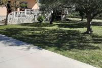 un patio con árboles, una valla y una acera en Apartments by the sea Bibinje, Zadar - 5786, en Bibinje