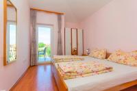 Postel nebo postele na pokoji v ubytování Apartments 4 Palme