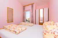 Postel nebo postele na pokoji v ubytování Apartments 4 Palme