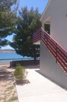 a house with a staircase on the side of it at Apartment Seline 11197b in Starigrad