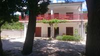 a white house with red seats on top of it at Apartment Seline 11197b in Starigrad